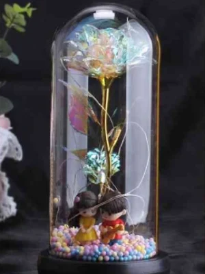 Rose artificielle dans cloche couple guitare